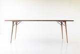 The New York, a modern distressed grey dining table with tapered legs and a weathered finish