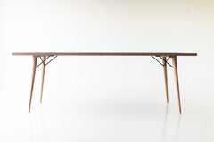 The New York, a modern distressed grey dining table with tapered legs and a weathered finish