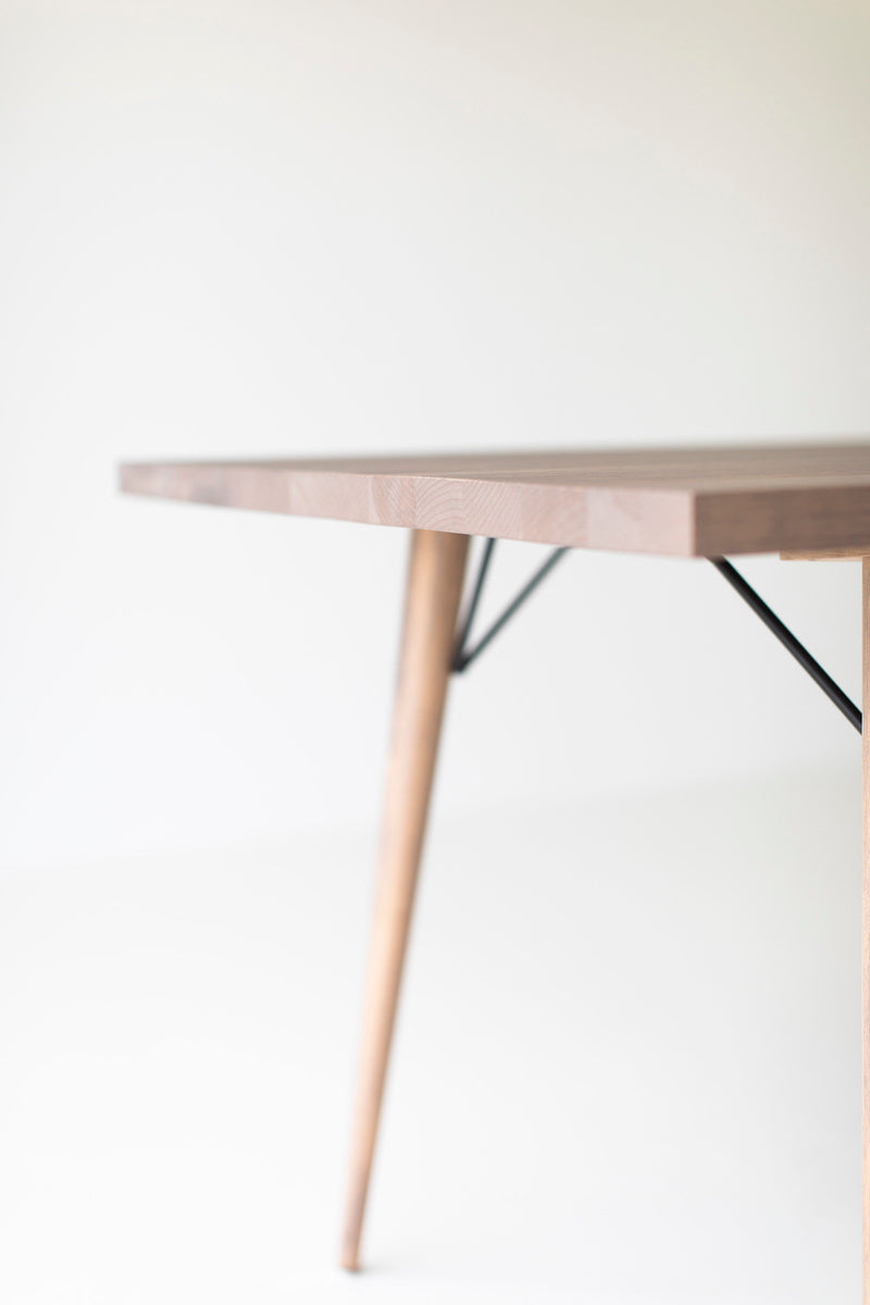Side profile of the distressed dining table showing its silhouette