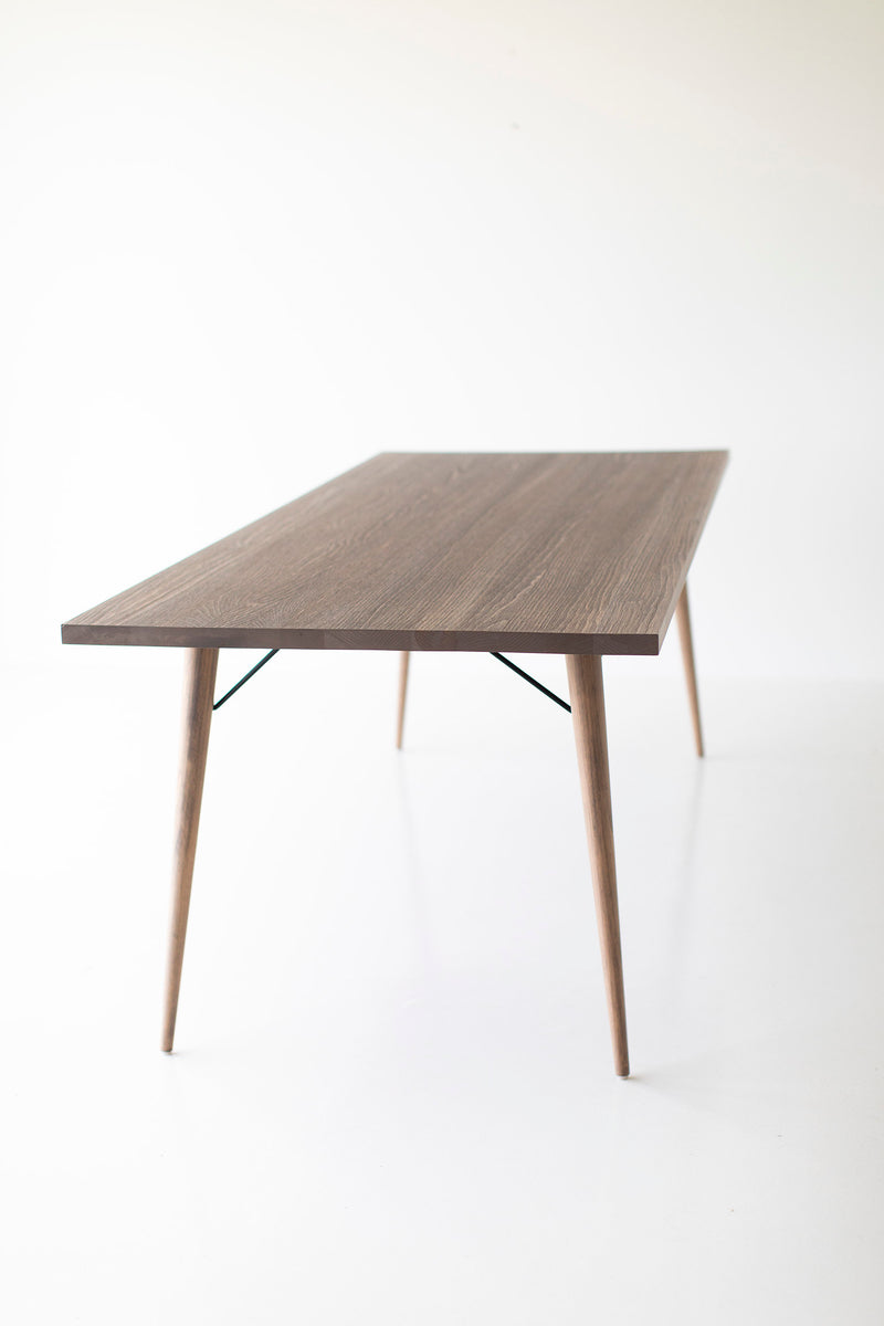 Distressed dining table styled as a desk in a home office