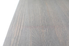 Close-up of the tapered leg detail on the distressed table