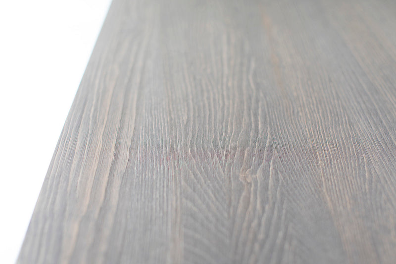 Close-up of the tapered leg detail on the distressed table