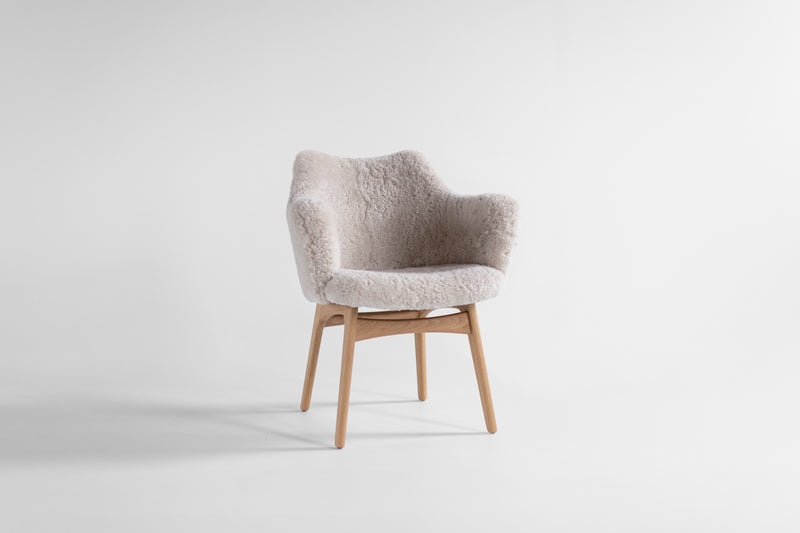 Executive dining chair in oak with fur upholstery