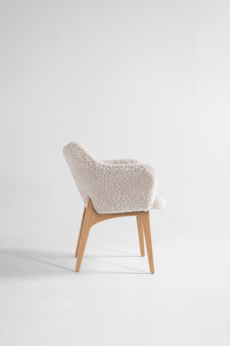 Detail of the oak wood grain and joinery on an executive dining chair