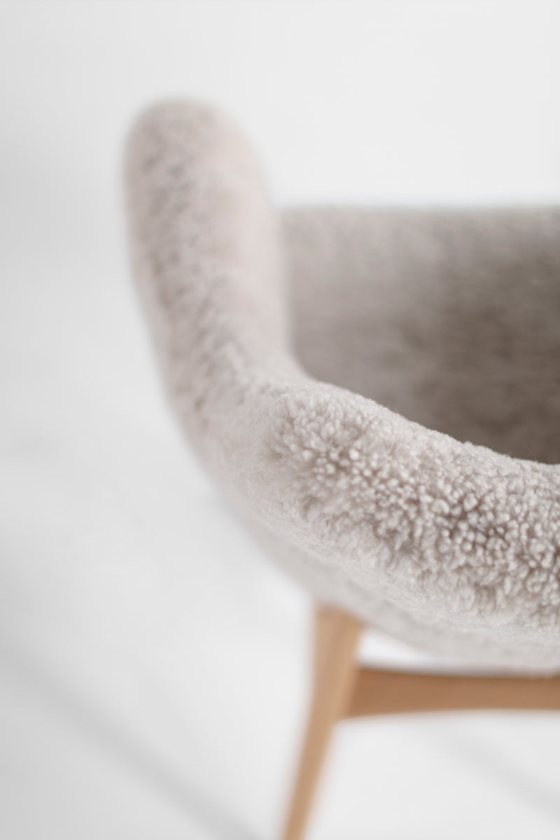 Executive dining chairs in fur styled around a dining table