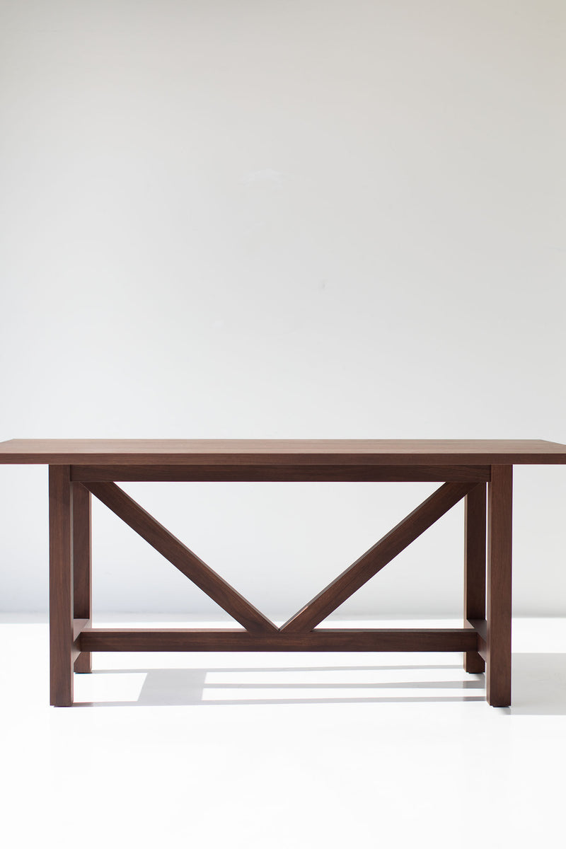 Modern luxury walnut farm table styled as a desk