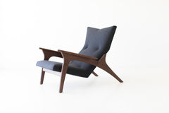 Modern luxury walnut wing chair, the Frank, with upholstered seat, front view