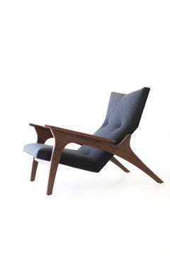 Detail of the hand-shaped walnut frame and base
