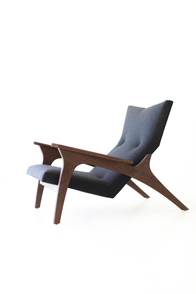 Detail of the hand-shaped walnut frame and base