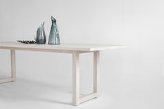 Harvest dining table styled with chairs in a dining room
