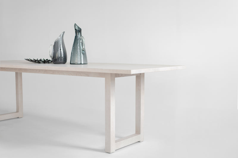 Harvest dining table styled with chairs in a dining room