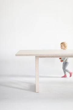 Detail of the joinery on a pickled white oak dining table leg