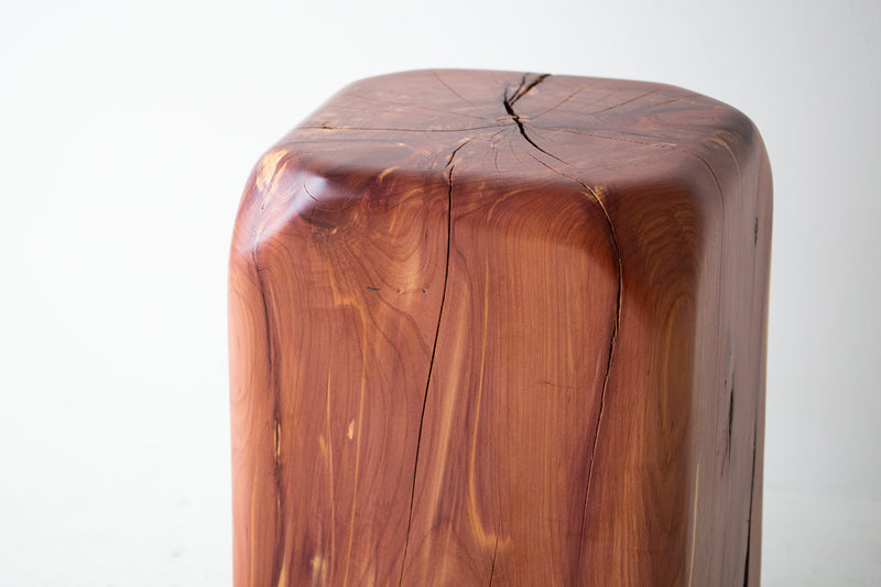 Softly angled, sculpted corners of the cedar stool