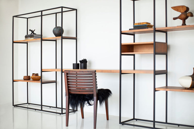 Front view of an industrial wall unit showing its floating desk area