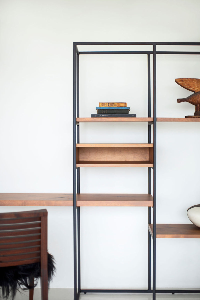 Side profile of an open shelving unit highlighting its iron framework