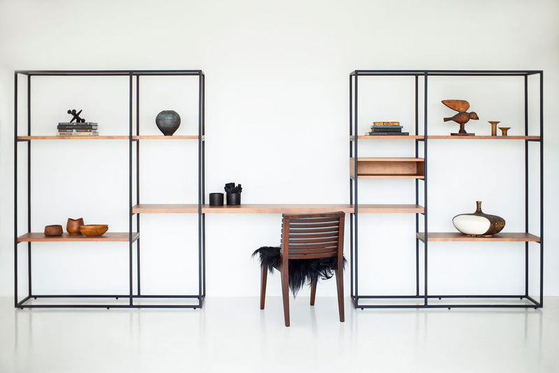 Close-up of the alder wood shelving and powder coated metal joinery