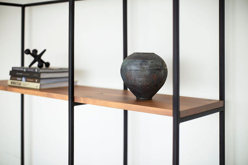 Angled view of an industrial wall unit showing its open drawer