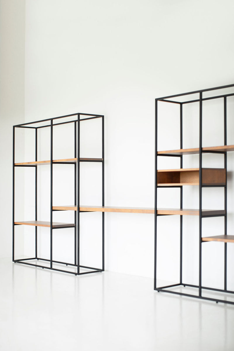Industrial wall unit styled in a home office with books and decor