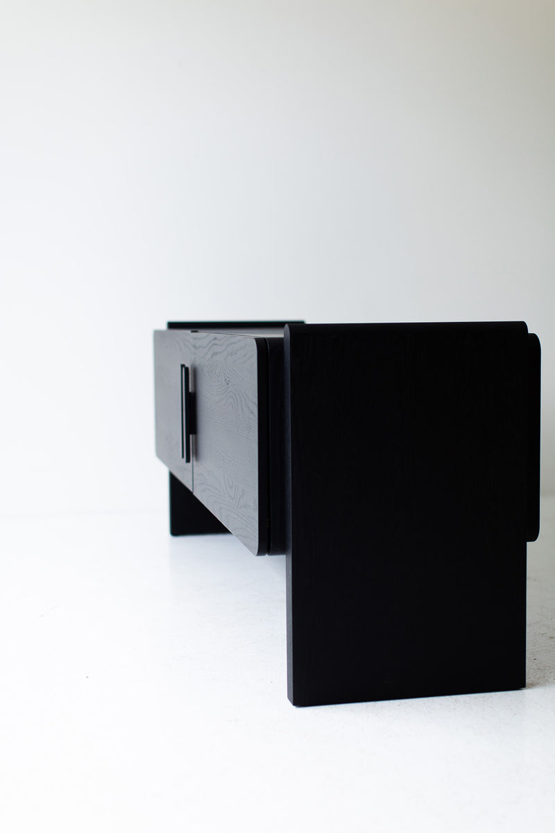 Iris credenza photographed at an angle to show its curved corners