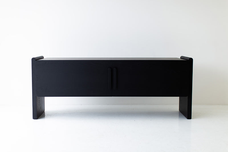 Close-up of a rounded corner on the black oak credenza