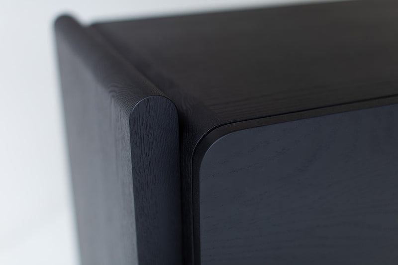 Detail of the chunky door pull on the oak credenza