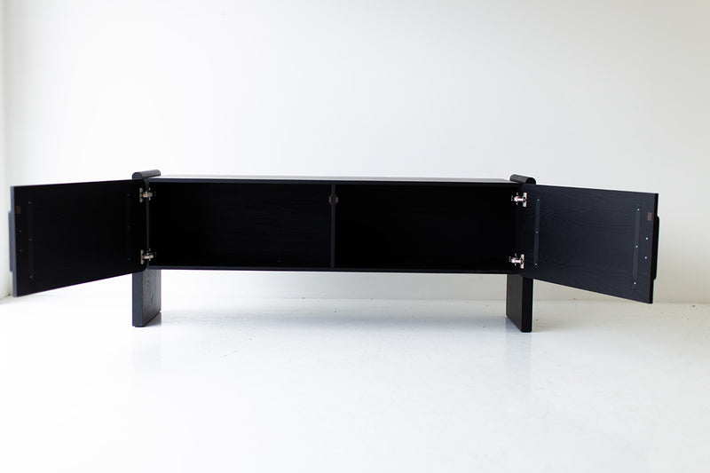 Interior of the credenza with adjustable oak shelving