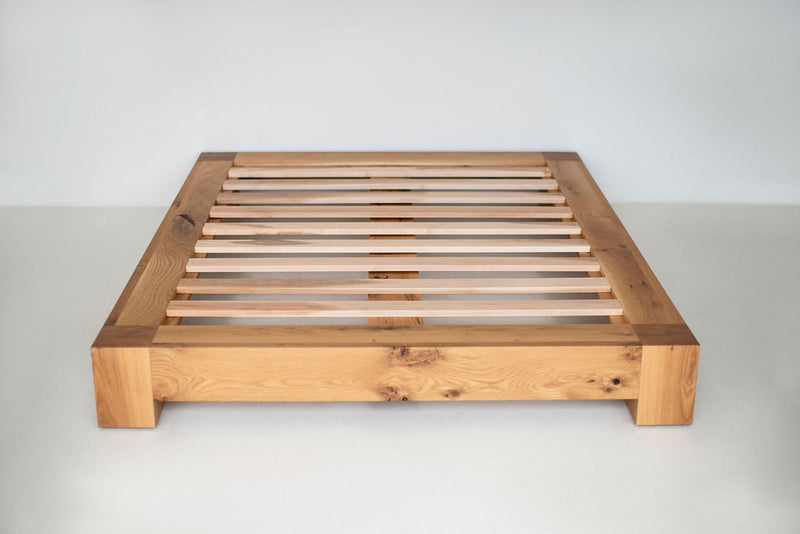 Rustic white oak platform bed with simple, clean lines