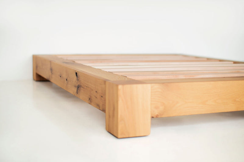 Front view of an Ithaca platform bed showing its low wood frame