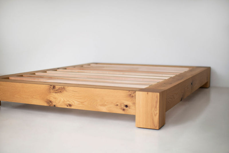 Ithaca platform bed styled in a minimalist, sunlit bedroom
