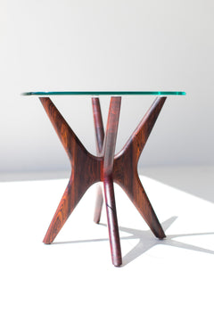 Detail of the glass top and walnut frame on the Jax side table