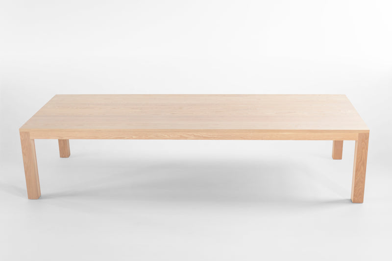 Modern luxury solid white oak dining table with a bleached matte finish
