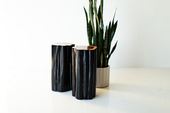 Close-up of the black exterior finish showing the natural wood grain