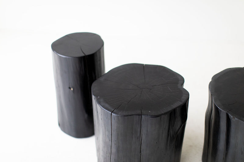 Tree stump side table styled next to outdoor seating