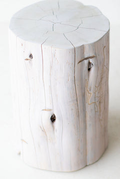 White tree stump side tables grouped as an organic modern coffee table