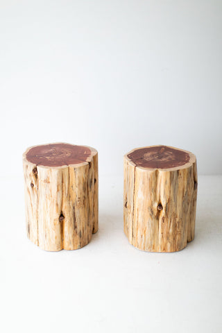 Natural wood stump table styled as a modern nightstand