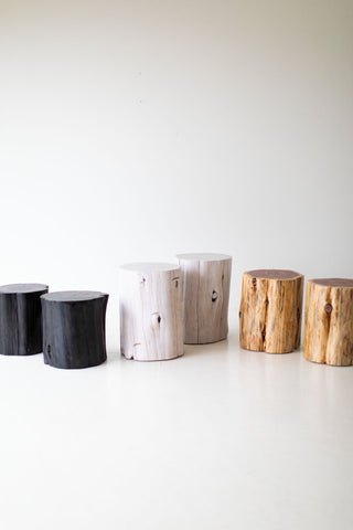Grouping of natural stump tables as a modern coffee table