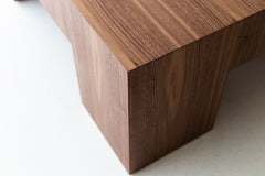 Close-up of the walnut veneer grain on the tabletop