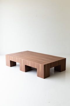 Modern luxury walnut coffee table in front of a sofa in a living room