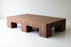 Large modern walnut Mondo coffee table against a neutral backdrop