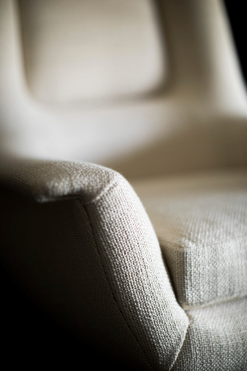 Close-up of the hand-applied oil finish on the walnut base