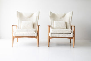 Modern luxury boucle wing chair styled in a modern living room