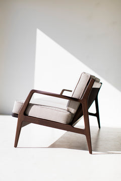 Detail of the hand-applied oil finish on the walnut sofa base