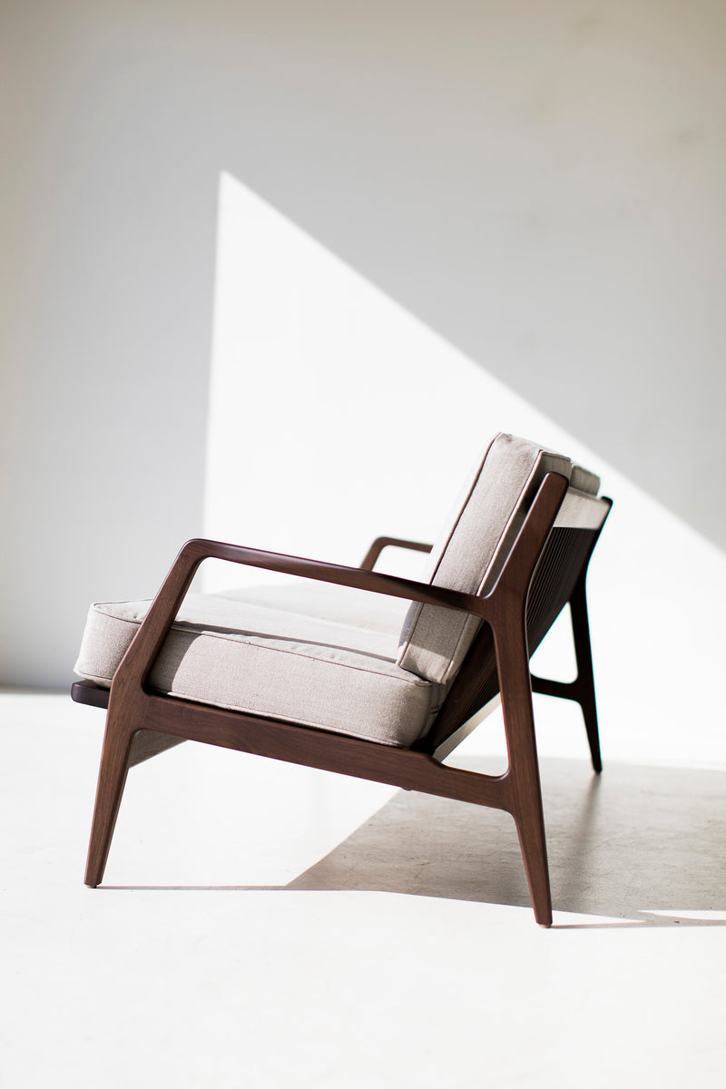 Detail of the hand-applied oil finish on the walnut sofa base