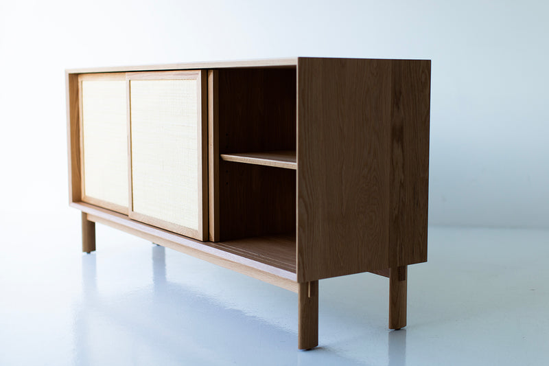 Modern luxury oak three door cabinet with cane front doors, designed by Lawrence Peabody