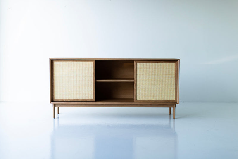 Side profile of the cane front cabinet showing its oak legs