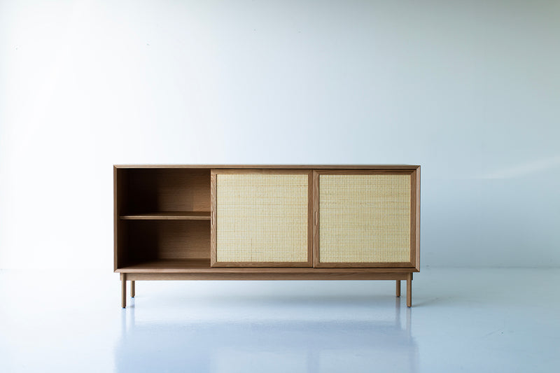 Peabody cane front cabinet styled in a modern luxury living room
