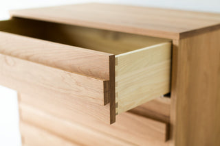 Modern luxury white oak dresser styled in a contemporary bedroom