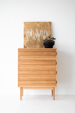 White oak four-drawer dresser with all drawers closed