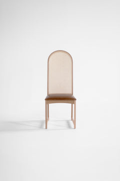 Side profile of the Milo Baughman dining side chair highlighting its high arched back