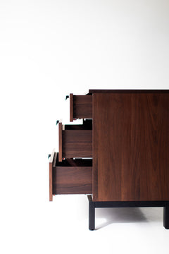 Angled view of the chest and its solid walnut frame